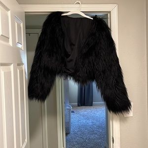 Black fur coat and red bodysuit